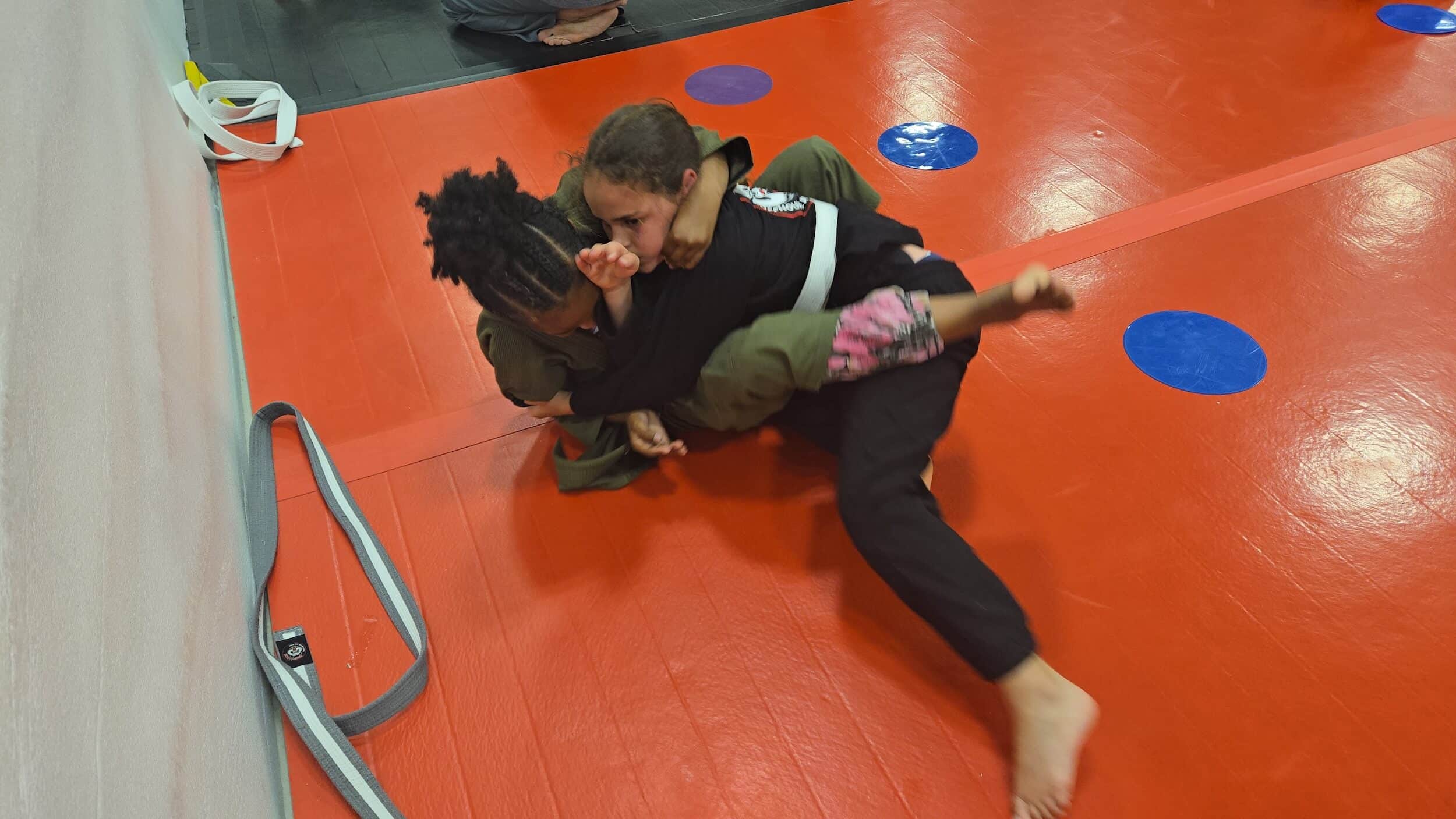 Ruffhouse Jiu-Jitsu young BJJ students grappling during youth BJJ class.