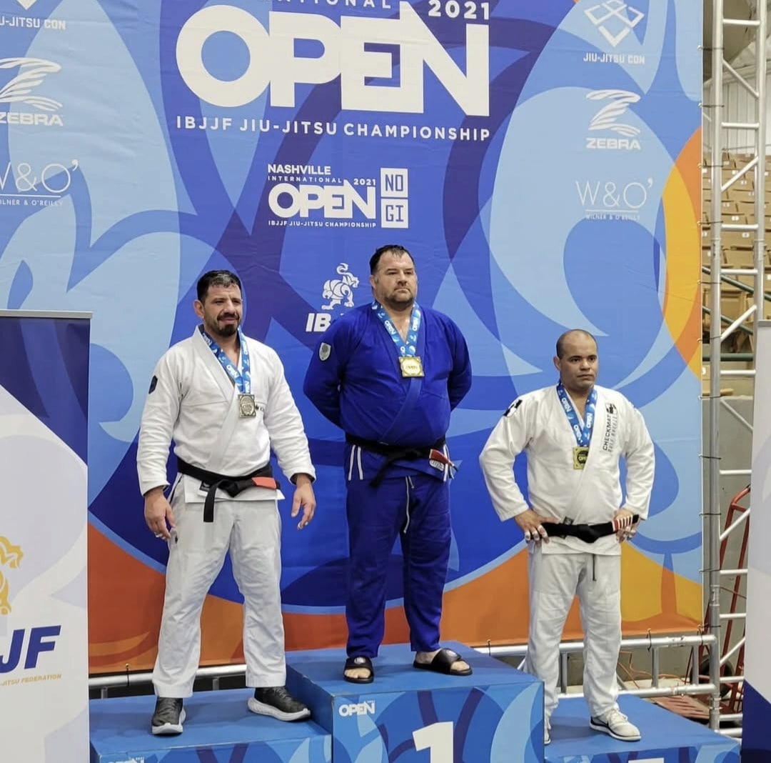 Ruffhouse Jiu-Jitsu Columbus students standing on winners podium.