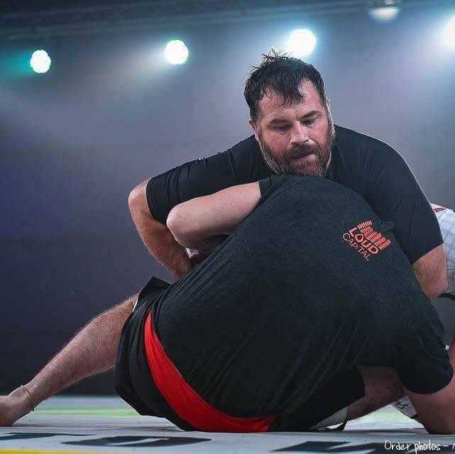 Ruffhouse Jiu-Jitsu student sparring with opponent during BJJ competition.